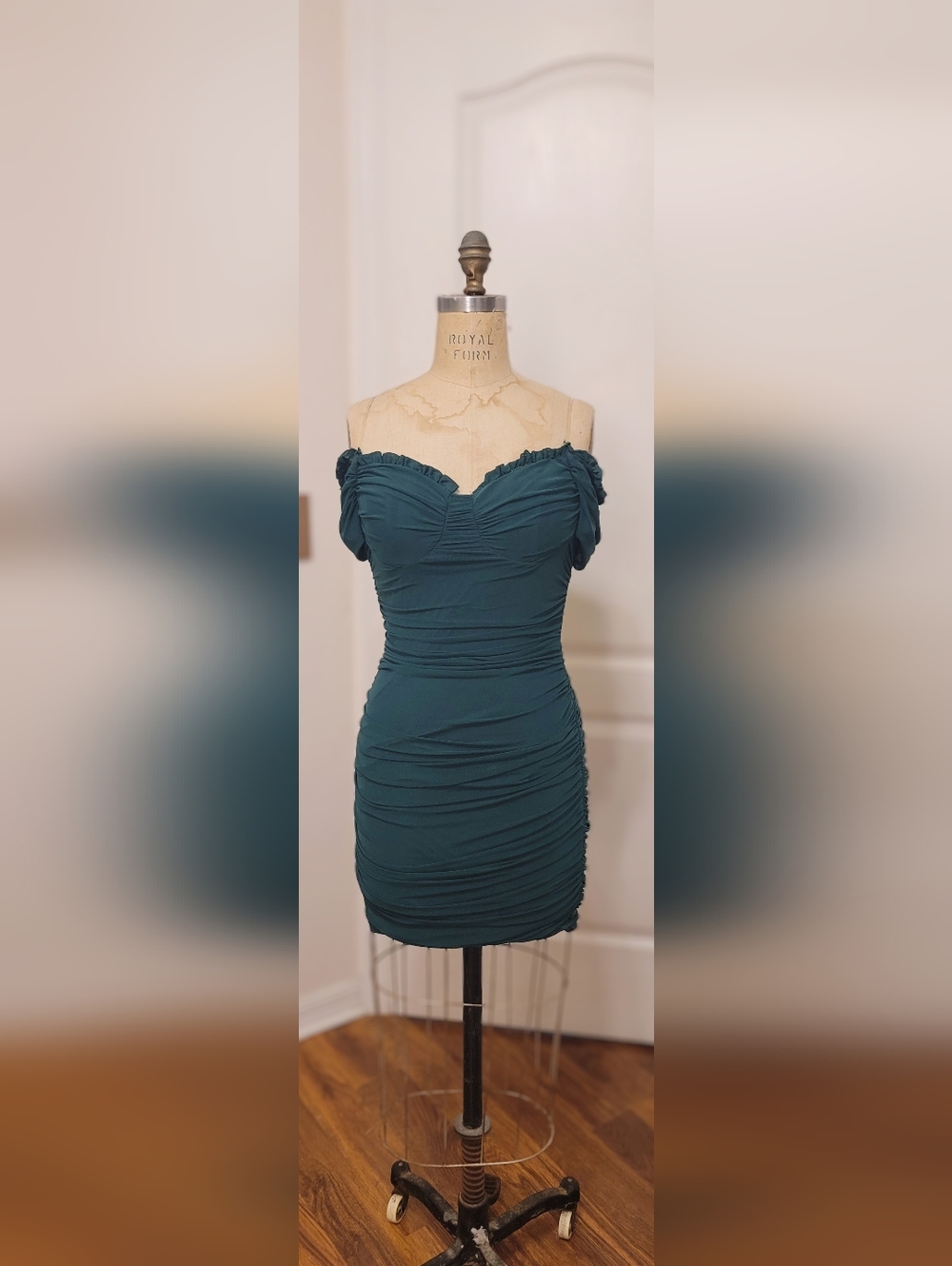 Windsor ruched bodycon mini dress featuring an off-the-shoulder neckline.